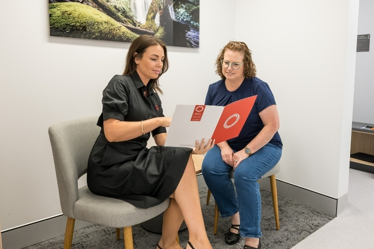 Administrator answers female patients frequently asked questions.
